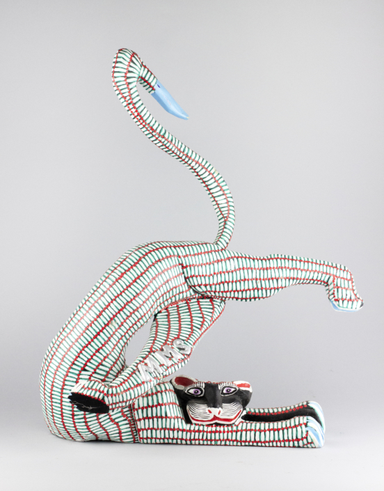 Margarito Melchor and Maria Teresa Santiago, Red and White Striped Cat, 1989 wood, 9 x 14.5 x 22 in Collection of the Tucson Museum of Art. Gift of Shepard Barbash and Vicki Ragan. 2018.22.330